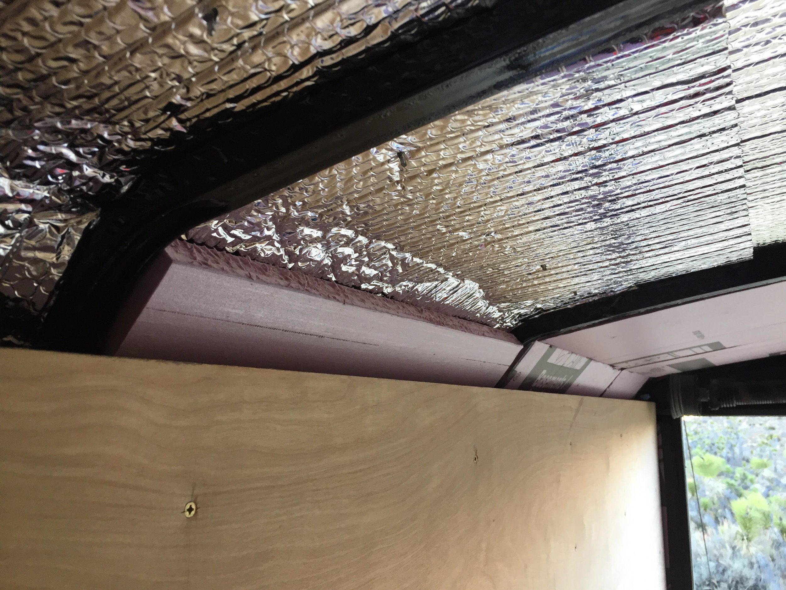 XPS under foil-backed bubble wrap. Another layer of 1” insulation will go under the cavity insulation.