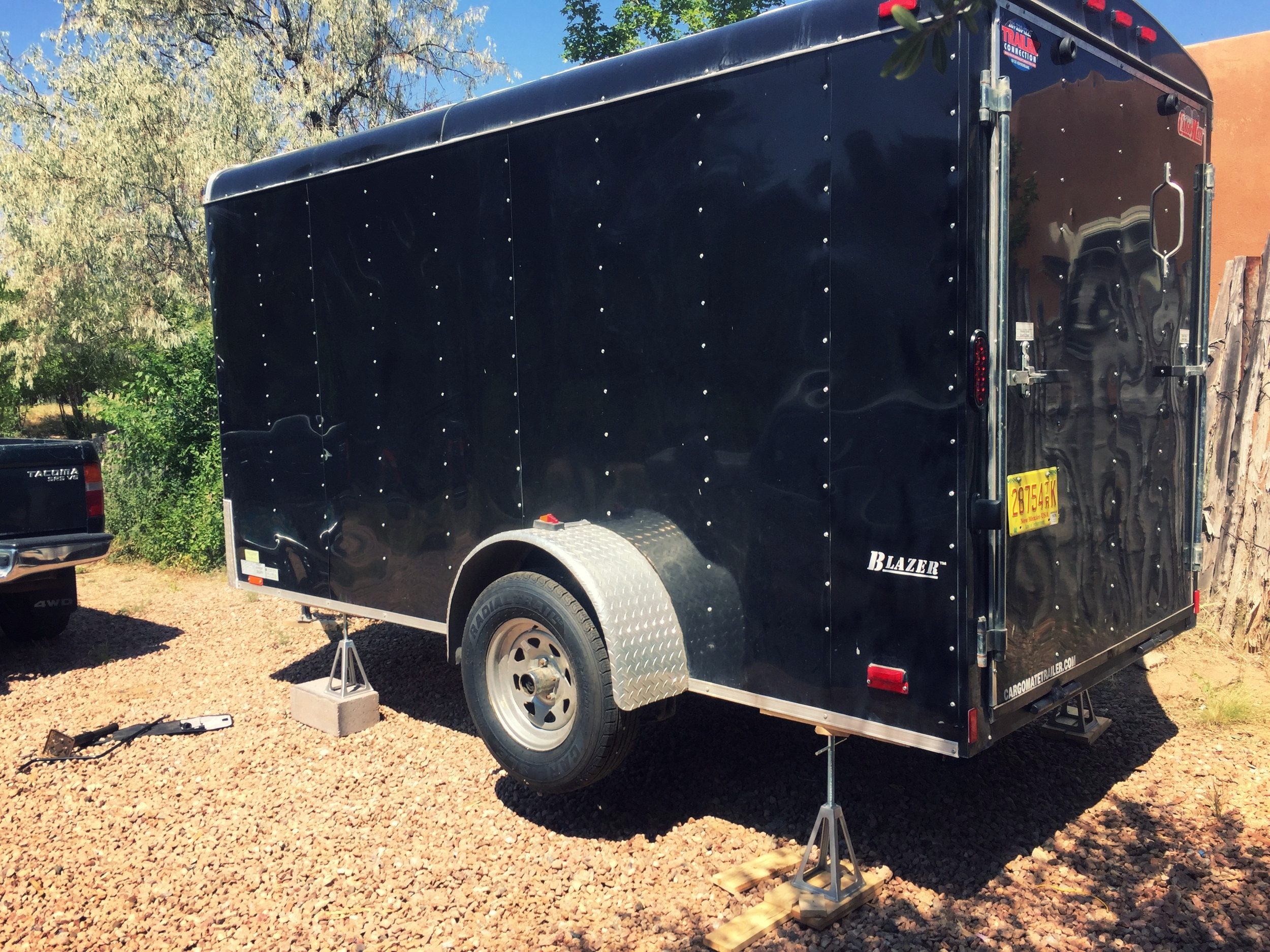 Jack the trailer up onto jack stands. (Use a real jack to lift it, not the stands themselves!)