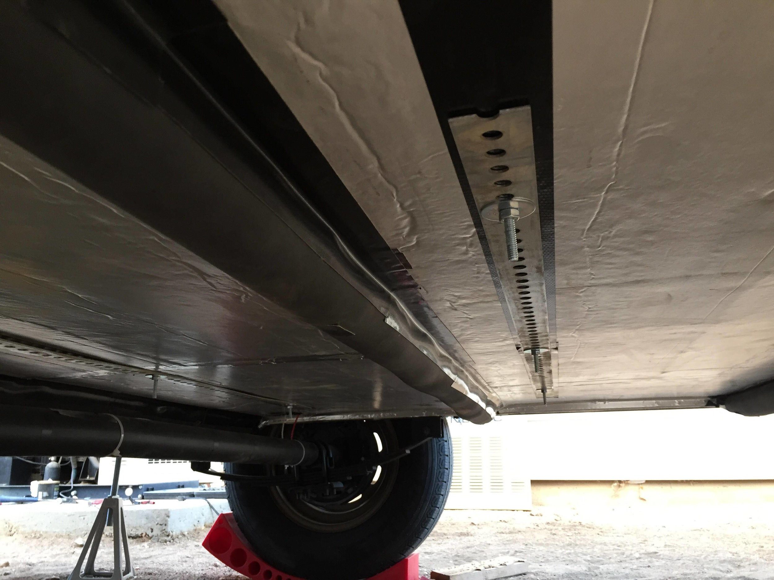 2” polyiso insulation with outdoor-rated pipe insulation to cut down on thermal bridging through the floor joists.