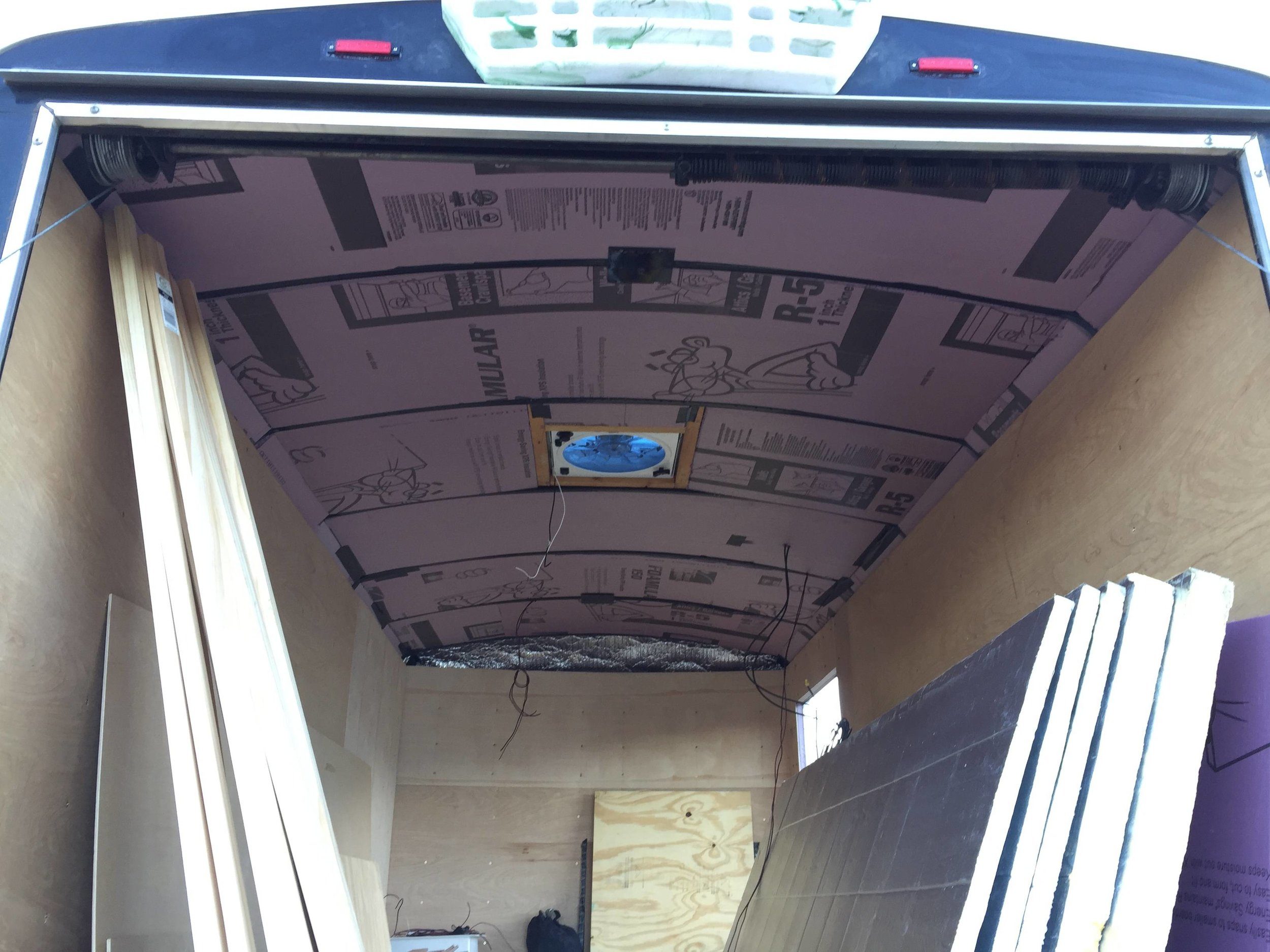 The first layer of ceiling insulation is in, in between the roof ribs. If I stopped here, those ribs would get too hot to touch for more than a couple seconds on a sunny day.