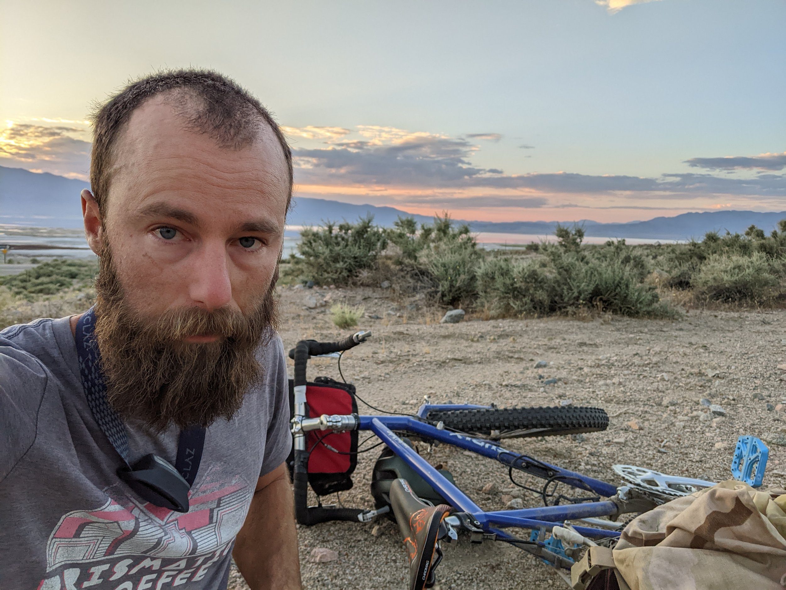 a tired bikepacker in the desert